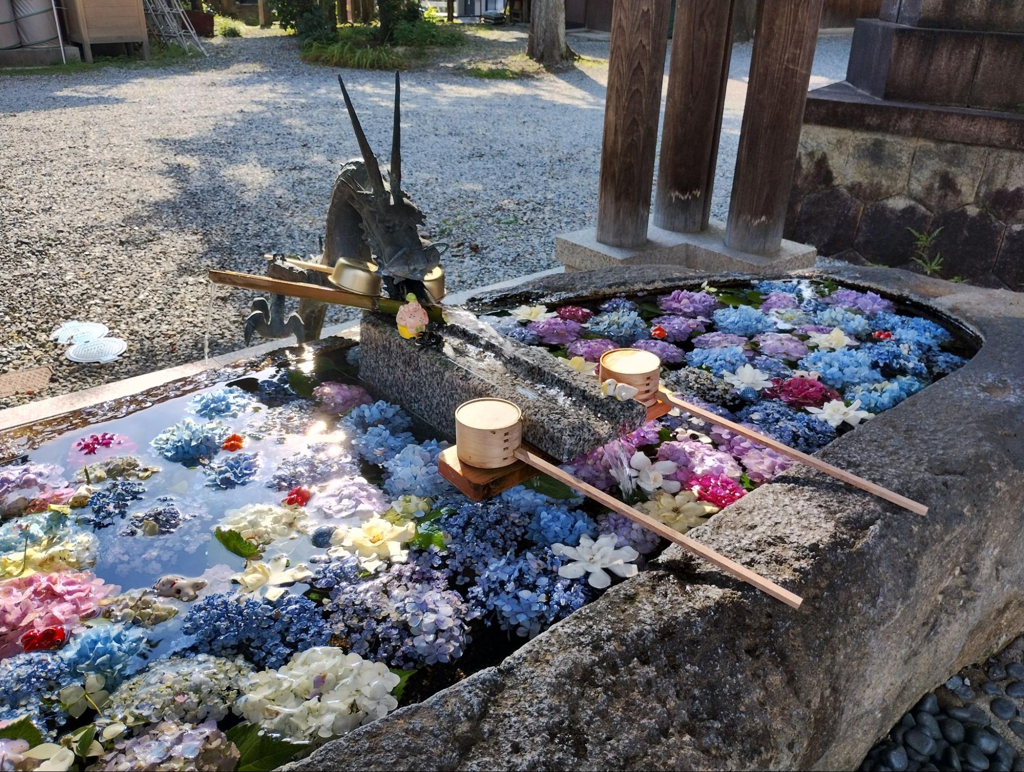 Flower-filled water basin at Nishinomiya Shrine